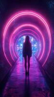 Woman stands in glowing tunnel with neon lights at night in an urban setting photo