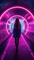 Young woman walking through a glowing neon tunnel with circular lights in a vibrant urban setting at night photo