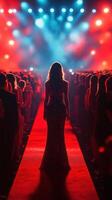 Spotlight shines on fashion model walking down red carpet at glamorous event in vibrant atmosphere photo
