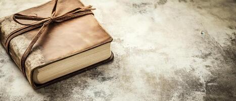 Leather Journal With Tie On Surface photo