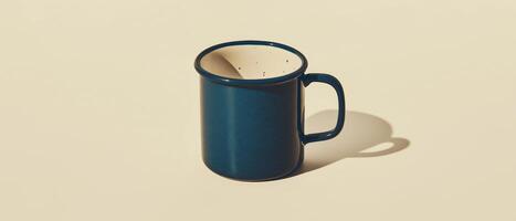 Dark Blue Enamel Mug On Beige photo