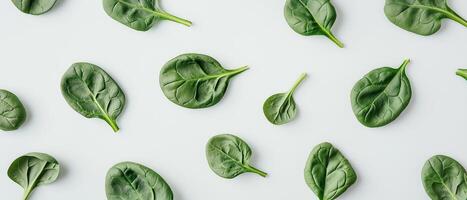 Fresh Spinach Leaves Pattern On White photo