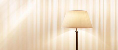 Illuminated Lamp Against Cream Striped Wallpaper photo