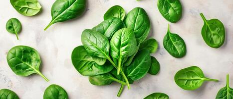 Fresh Green Spinach Leaves On Marble photo