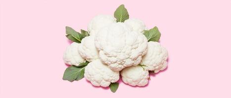 Pile Of Fresh Cauliflower On Pink photo