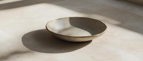 Empty Ceramic Bowl On Beige Surface photo