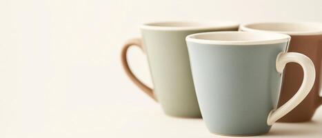 Three Pastel Coffee Mugs On White photo