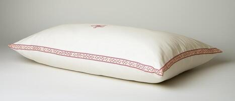 Embroidered Pillow-On White Sheet-Studio Shot photo