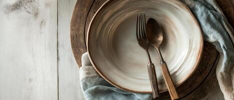 Rustic Table Setting With Plate And Silverware photo