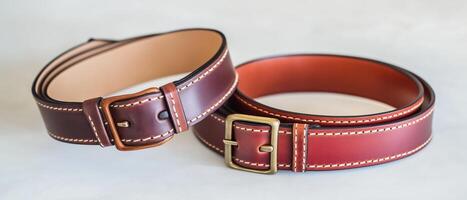 Two Leather Belts With Metal Buckles photo