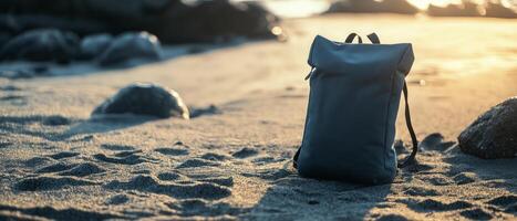Backpack On Beach At Sunset photo