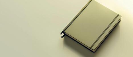 Closed Notebook On Neutral Background photo
