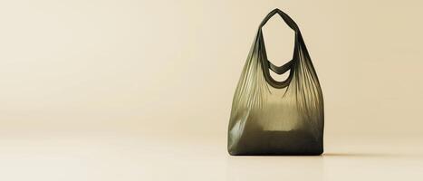 Green Plastic Bag On Beige Background photo