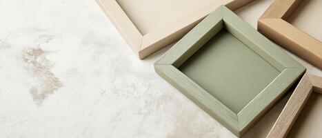 Wooden Frames On Neutral Surface Close-up photo