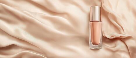 Nude Foundation Bottle On Silk Fabric photo