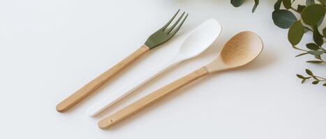 Wooden Spoon, White Spoon, and Fork photo