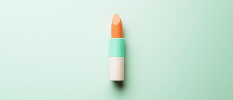 Pastel Orange Lipstick on Light Green Background photo