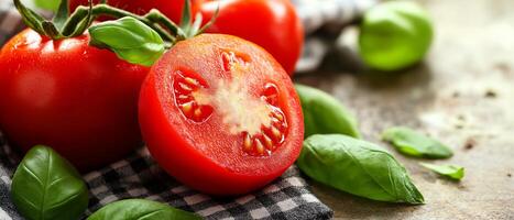 Fresh Tomatoes With Basil On Tablecloth photo