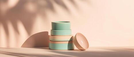 Pastel Ceramic Bowls Stacked With Leaf Shadows photo
