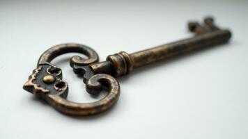 Ornate Antique Key On White Background photo