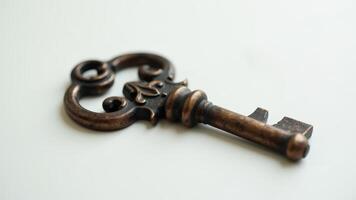 Antique Skeleton Key On White Surface photo