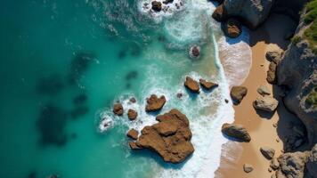 Aerial View Of Beach Coastline With Rocks photo