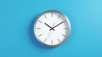 Analog Clock Hanging On Blue Wall photo