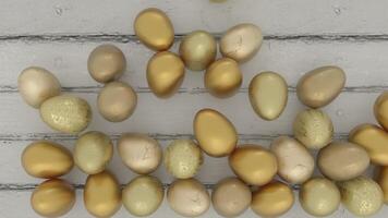 Colorful decorated gold Easter eggs creating frame border on rustic wooden background. Festive spring holiday composition with painted eggs. Top view. 3d rendering animation. video