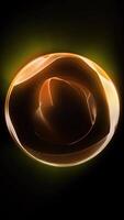 An orange neon ball glows in space, playing with its edges, shimmering with waves of energy. video