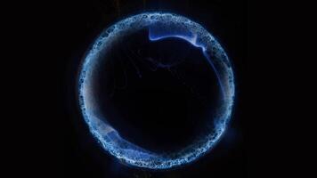 A virtual blue ball glows in space, playing with its edges, shimmering with waves of energy. video