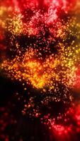 Gold and red glowing green particles fall like confetti in a seamless looping animation. video