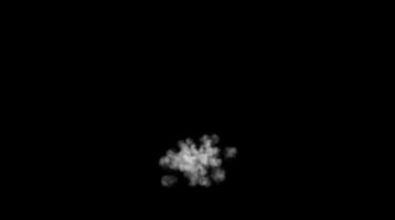 Compact white smoke burst expanding in darkness on black background. Atmospheric effect concept video
