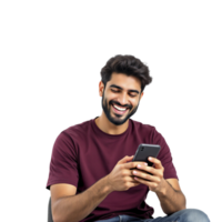 A man with a beard and a maroon shirt is sitting on a chair and smiling while using png