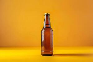 A brown beer bottle on a yellow background photo