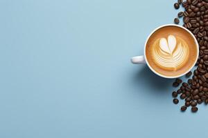 Coffee beans and latte art on blue background top view photo