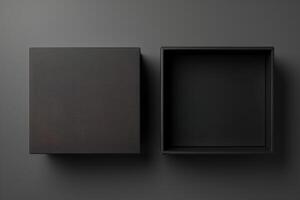 Two empty black boxes on a gray background photo