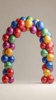 Colorful balloon arch decoration in a minimalist setting for celebrations or events photo