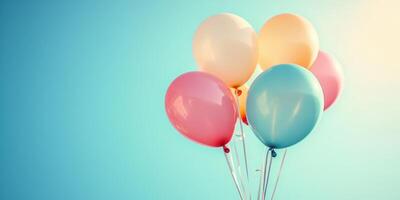 Colorful balloons floating against a bright blue sky create a joyful atmosphere for any celebration or event photo