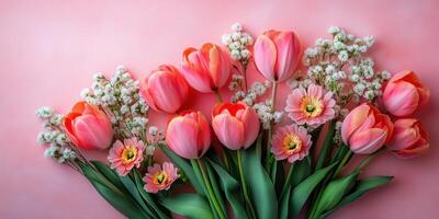 Beautiful spring bouquet featuring pink tulips, daisies, and delicate white accents arranged on a pastel background photo