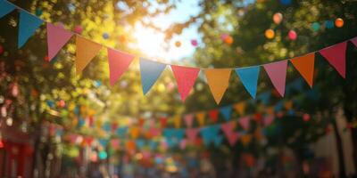 Colorful bunting decorations adorn a sunny street during a festive celebration in the afternoon photo
