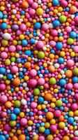 Colorful assortment of candy sprinkles fills the surface with vibrant hues in a playful arrangement photo