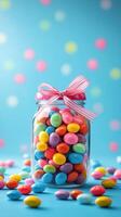 Colorful candy jar filled with vibrant sweets on a bright blue background for a cheerful celebration photo