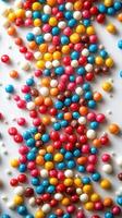 Colorful candy assortment scattered on a surface creating a vibrant pattern and inviting sensory experience photo