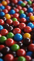 Colorful sugary candies scattered on a dark surface create an enticing visual display of sweetness photo