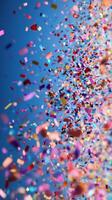 Colorful confetti fills the air during a festive celebration in a vibrant atmosphere photo