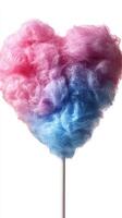Colorful heart-shaped cotton candy on a stick is perfect for celebrations and festive events photo