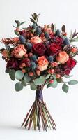 Beautiful bouquet of mixed roses and seasonal foliage arranged for a special occasion photo