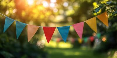 Colorful pennants sway gently in the breeze during a sunny garden celebration filled with joy and laughter photo