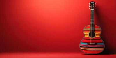Colorful acoustic guitar decorated with traditional patterns against a vibrant red background showcases craftsmanship and culture photo