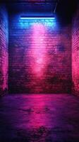 Vibrant neon lighting illuminates a textured brick wall in a darkened urban space photo
